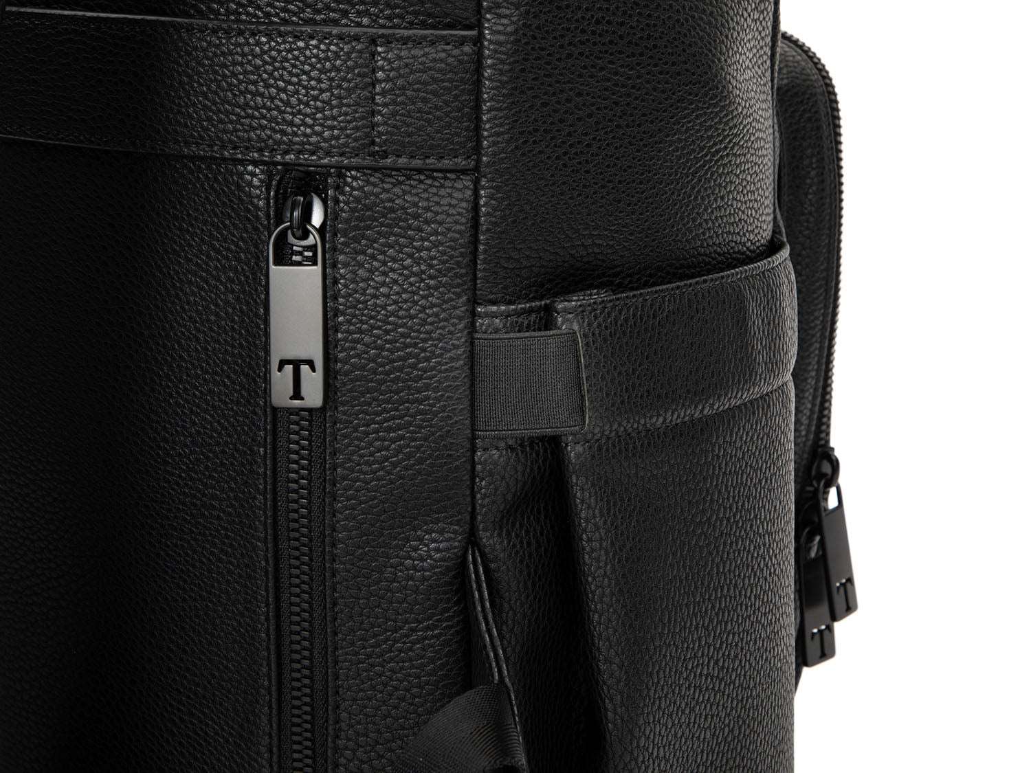 A black leather travel backpack with black zippers on white background