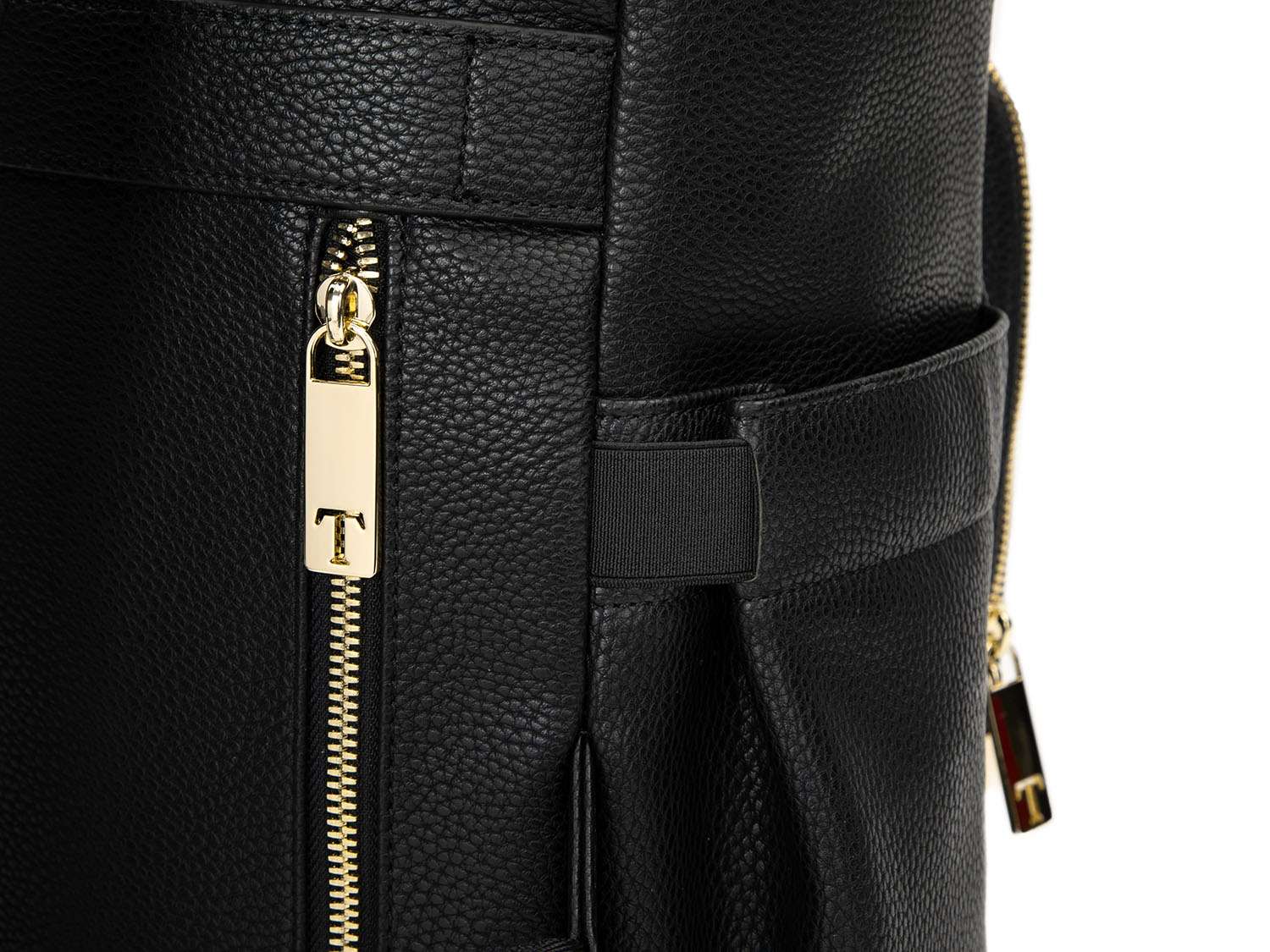 A black leather travel backpack with gold zippers on white background