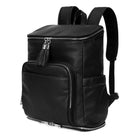 A black leather travel backpack with silver zippers on white background