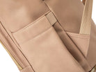 Close-up view of the vegan leather texture on a stone leather nappy backpack with a gold zipper from Tottie.