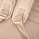 Close-up of nappy bag backpack straps with gold buckles