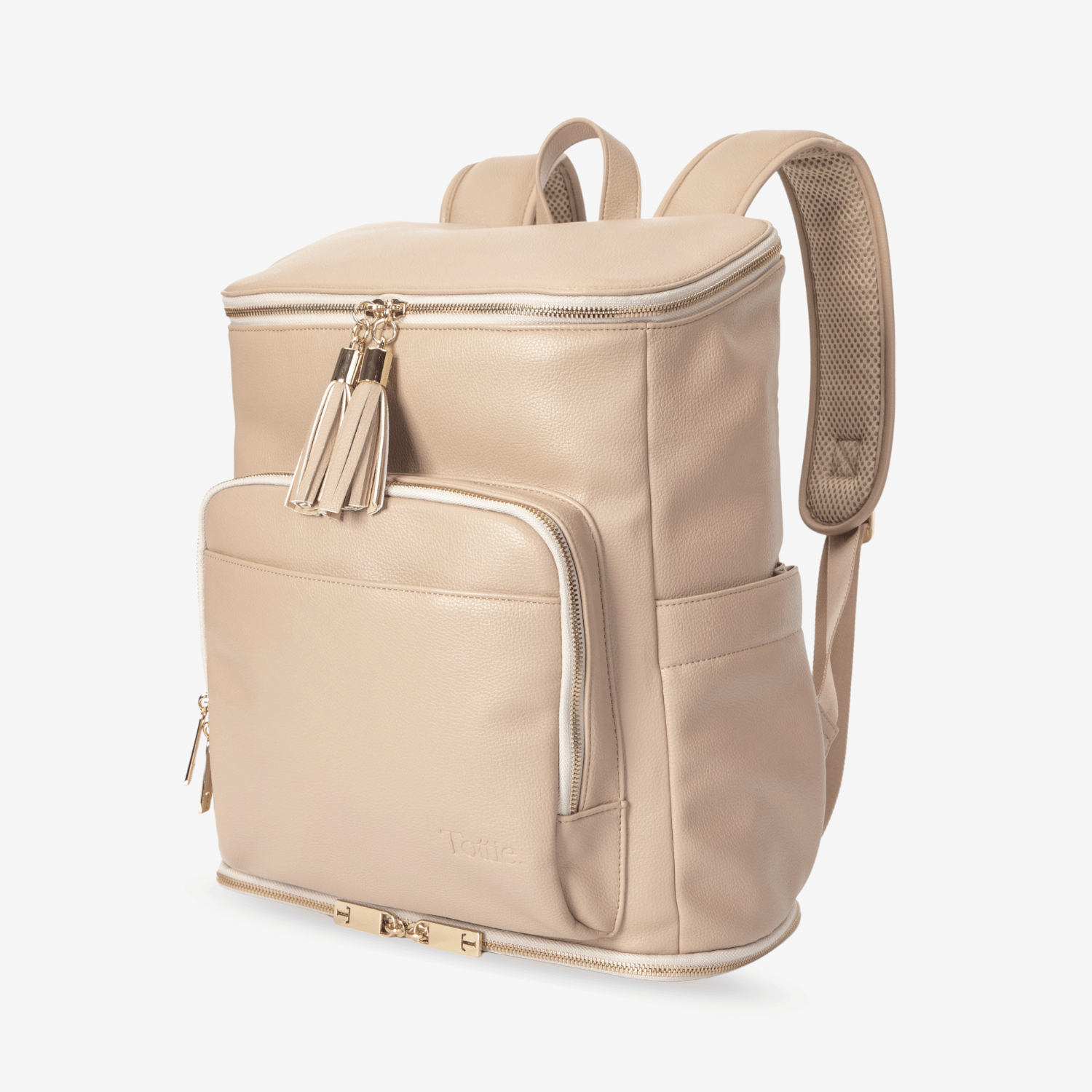 Beige nappy backpack with gold accents on a white background