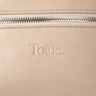 Beige leather bum bag with 'Tottie' branding and a gold zipper.