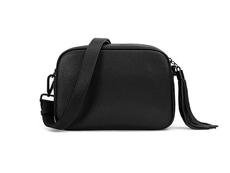 black leather crossbody bag in white background