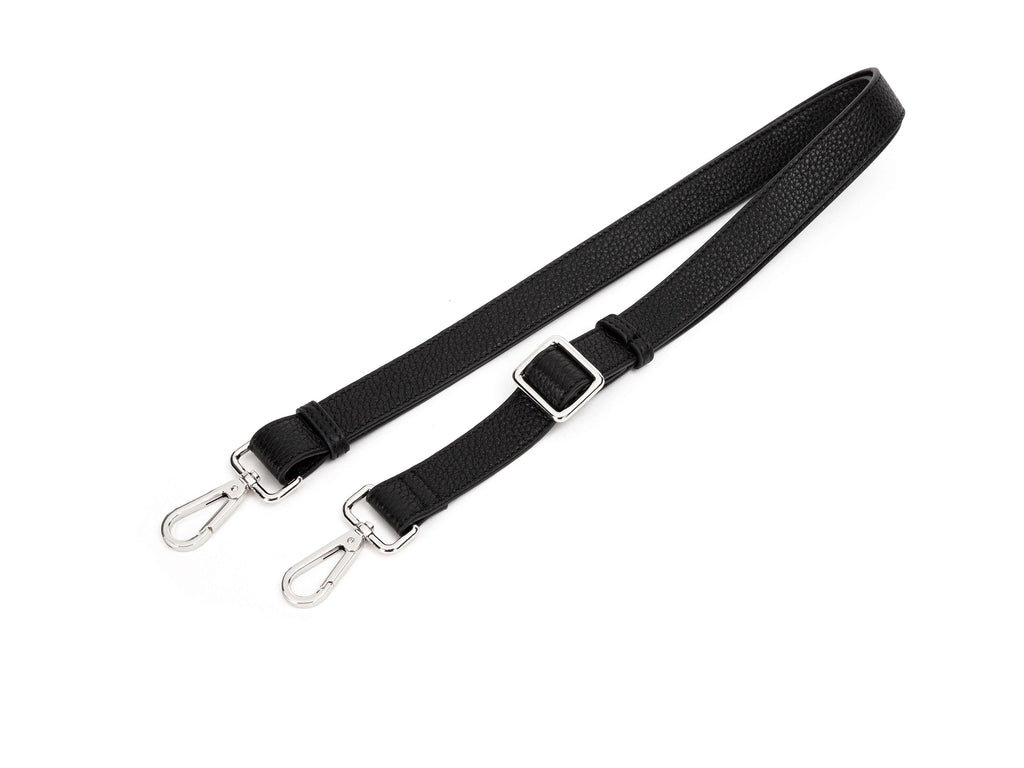 black leather bag strap with silver hardware in white background