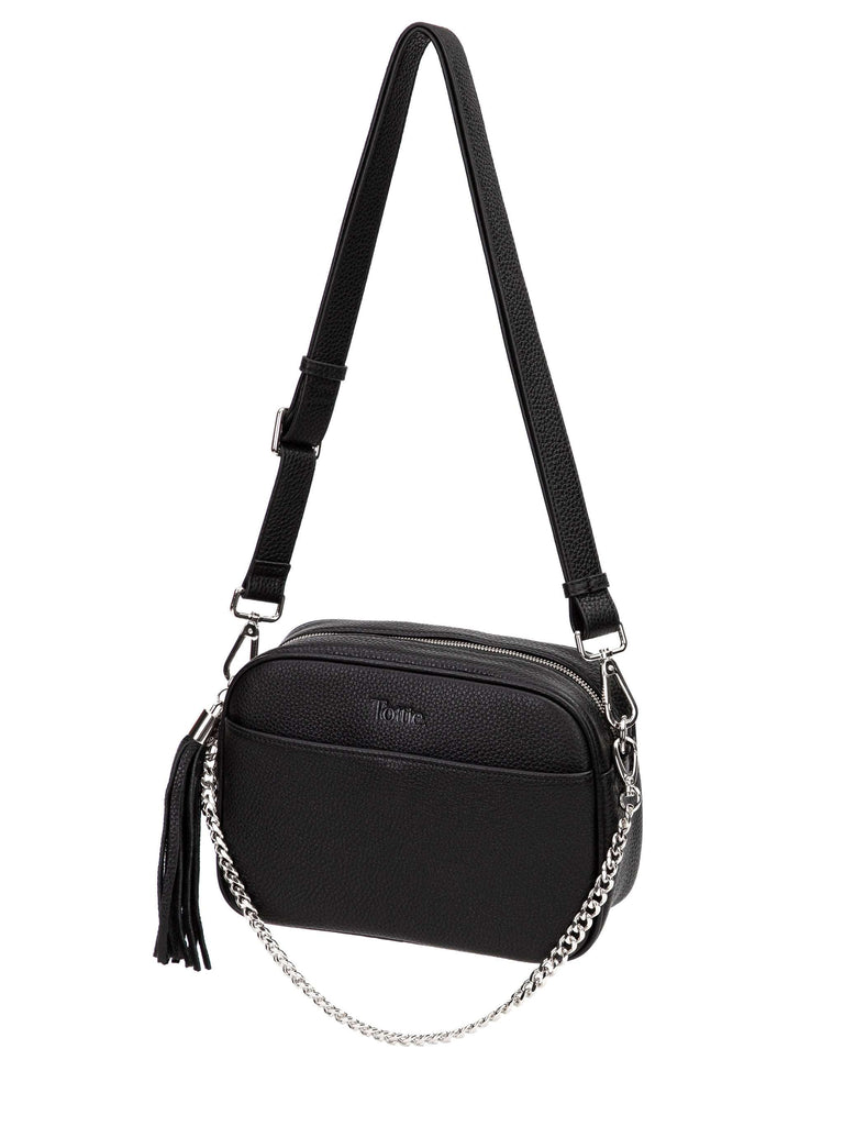 black leather crossbody bag with silver hardware in white background