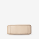 Stone leather crossbody bag bottom on a white background