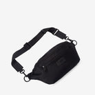 Black nylon bum bag with a strap on a light gray background