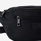 Black waist bag with zippers and a brand logo on a white background