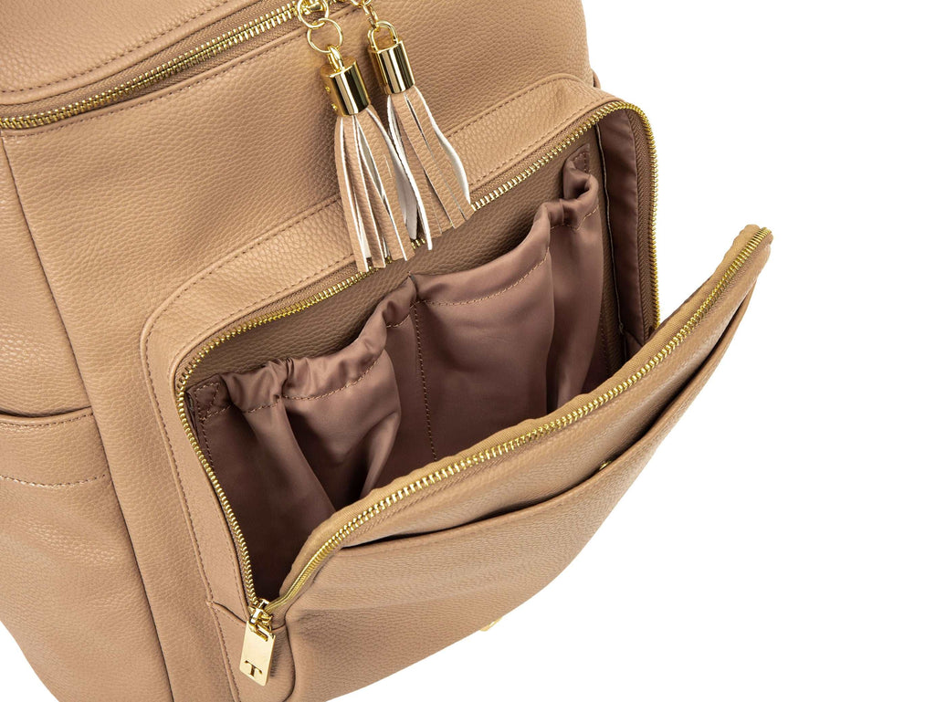 unzipped stone colored backpack with gold hardware on white background