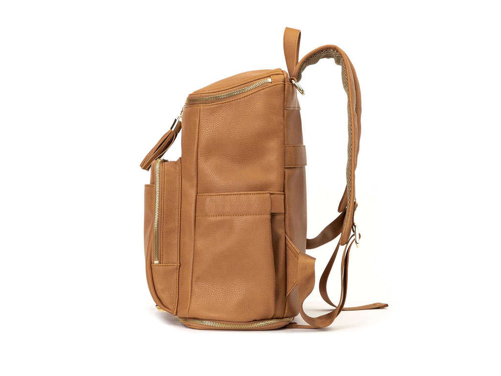tan colored backpack with gold hardware on white background