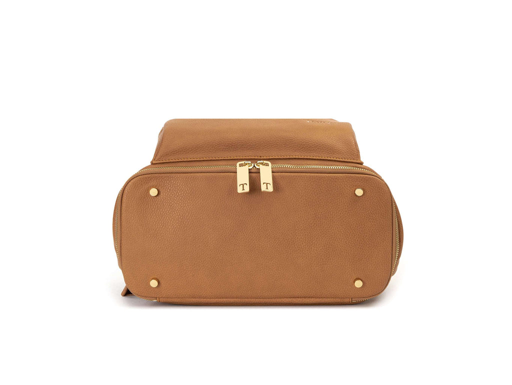 tan colored bag with gold hardware on white background