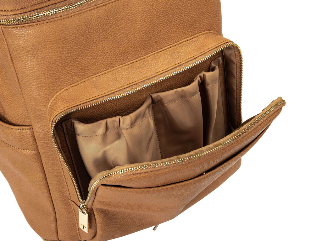 unzipped tan colored backpack with gold hardware on white background