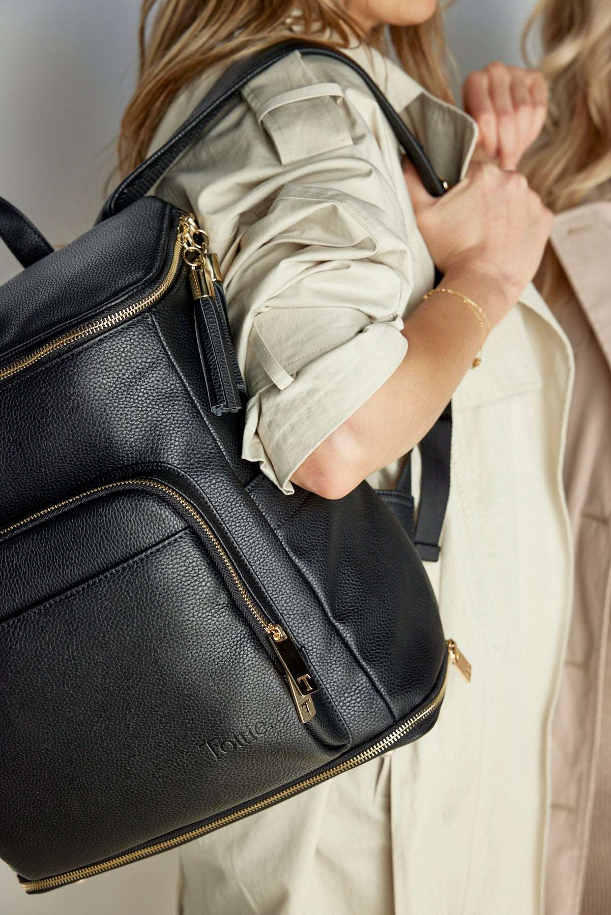 Black leather backpack gold zipper top